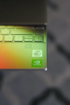 Detail of a laptop keyboard with Intel Core i7 sticker, captured indoors.