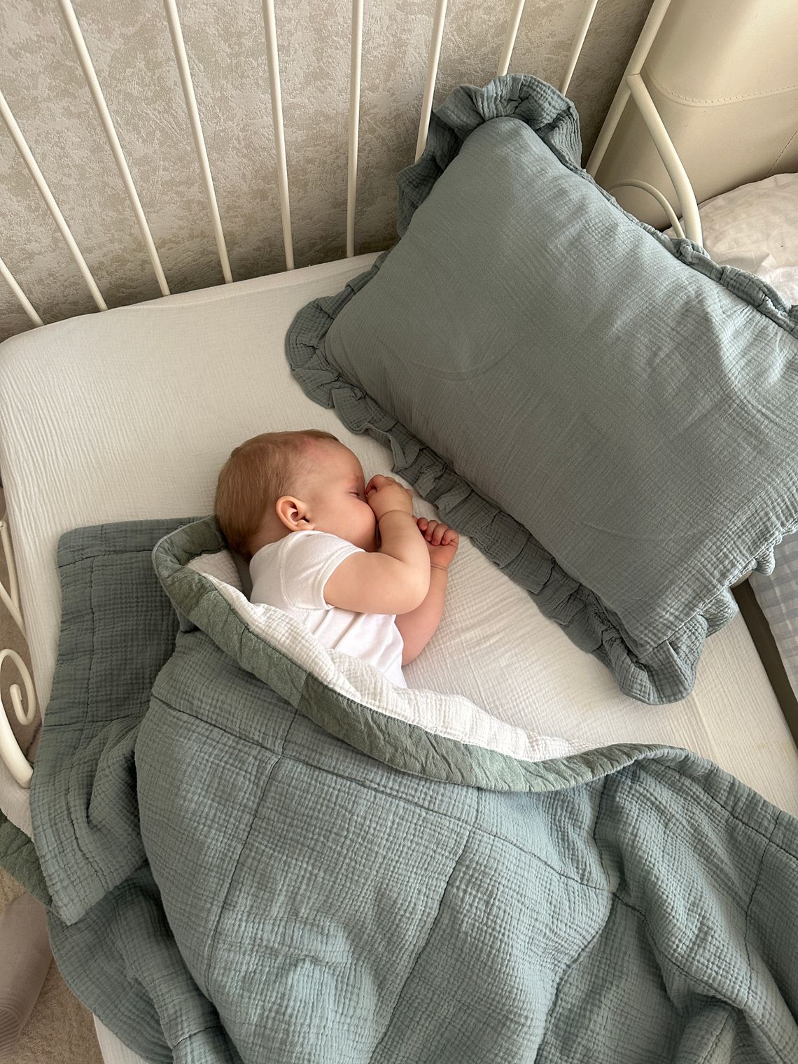 Baby sleeping peacefully in a crib