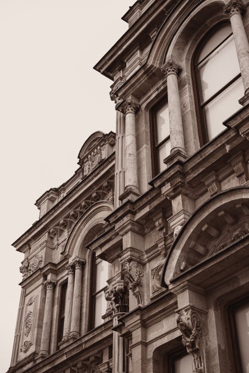 Free Sepia-toned close-up of Ottoman architecture at Beylerbeyi Palace, Istanbul, highlighting intricate stonework. Stock Photo