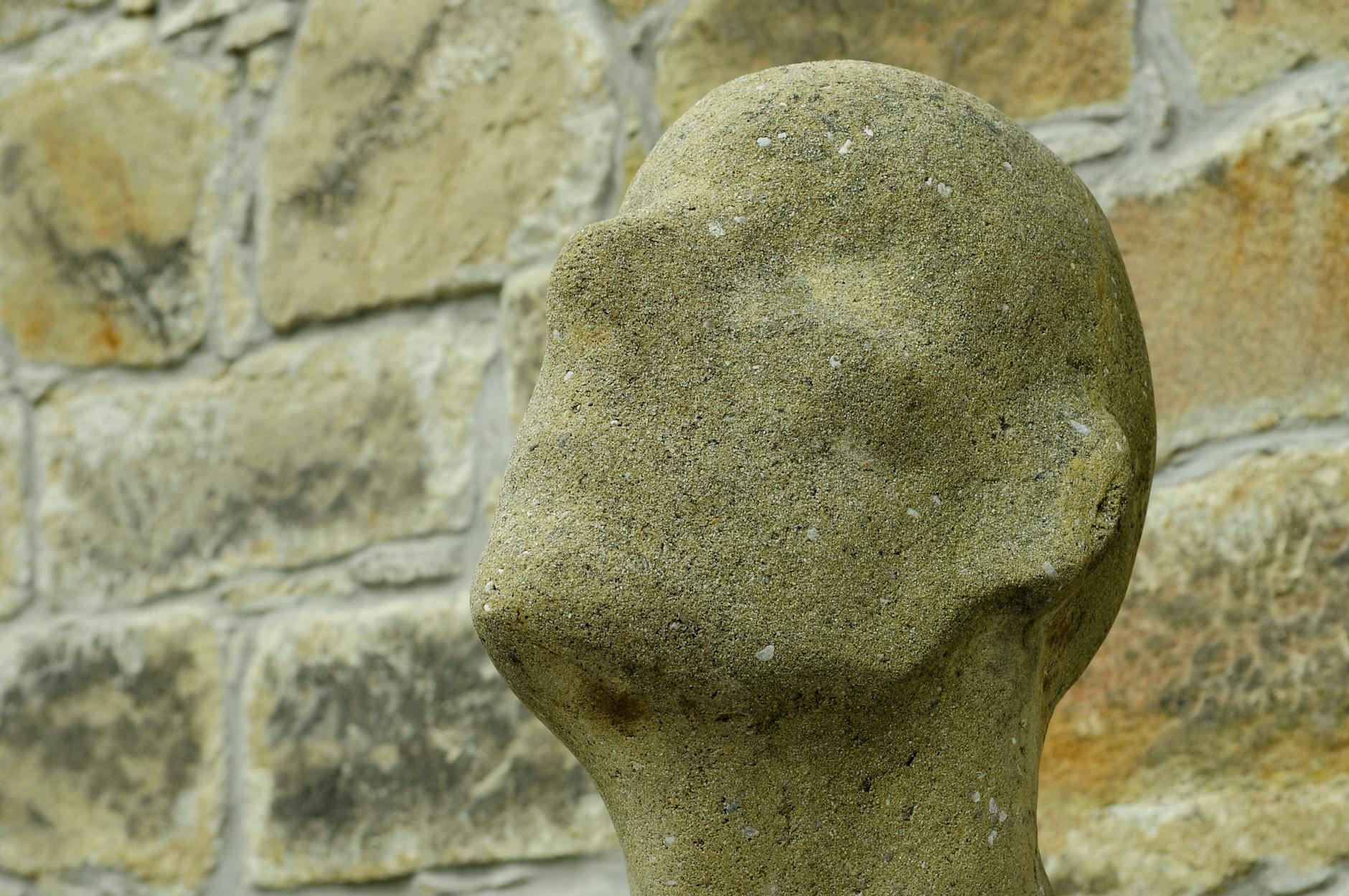 Businessperson analyzing data on a laptop, surrounded by graphs and charts.