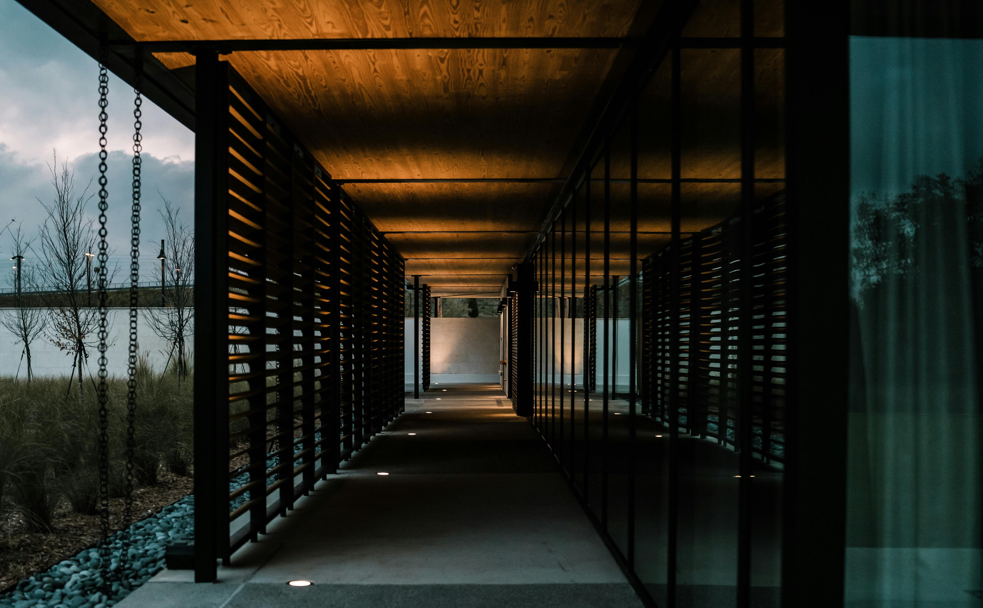 A garden path at dusk illuminated by low-voltage landscape lighting fixtures along the edge - Garden path pavers