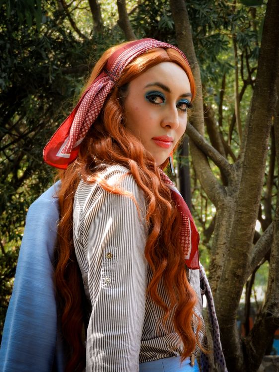 Young Woman with Red Hair in Urban Forest Setting · Free Stock Photo
