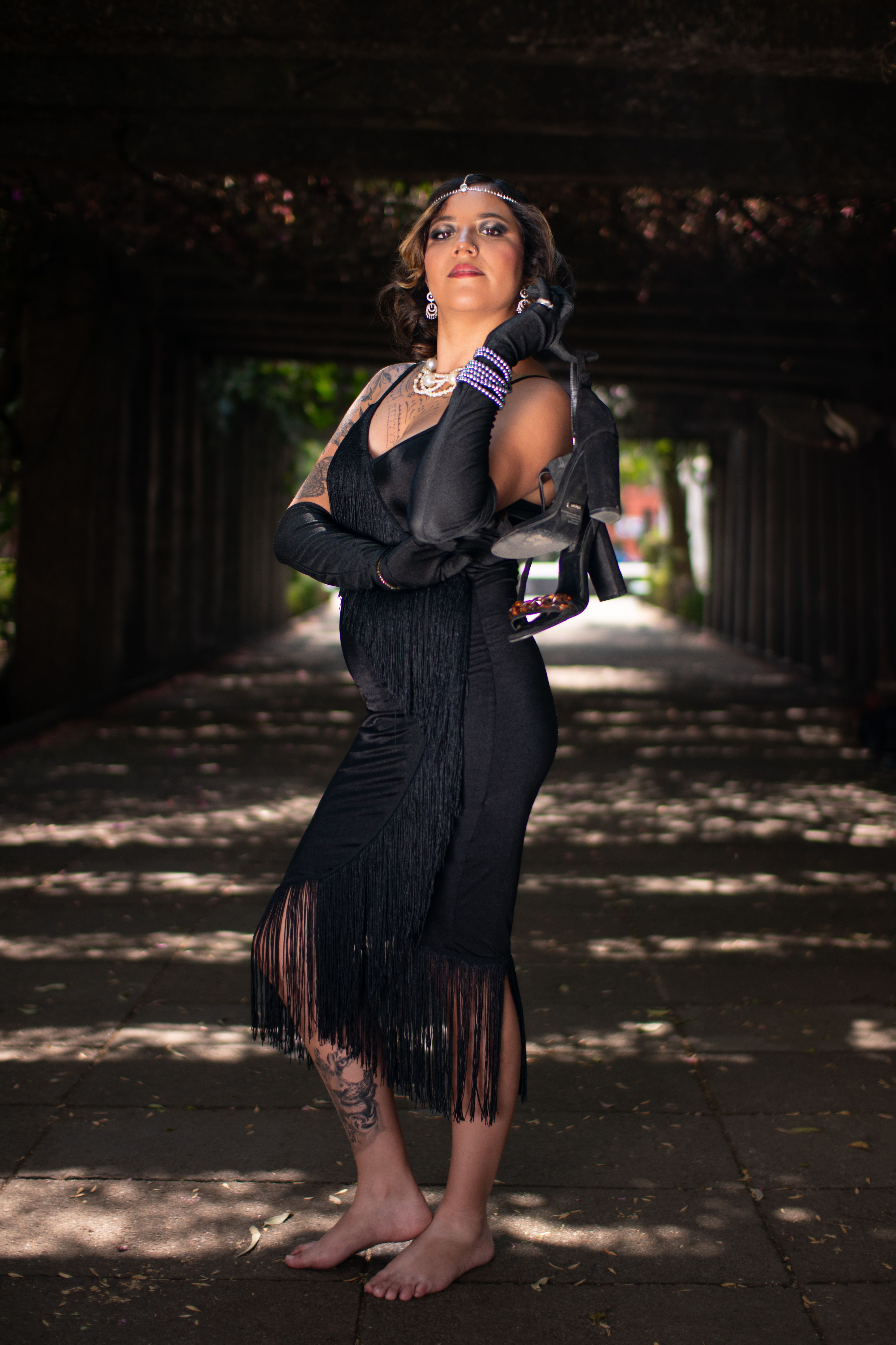 Brunette Woman in Dress Standing Barefoot and Holding High Heels · Free ...