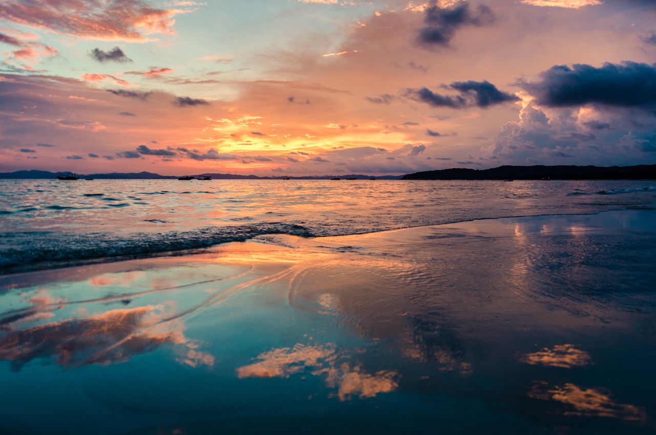 stunning sunset over the ocean with vibrant reflections on a tranquil