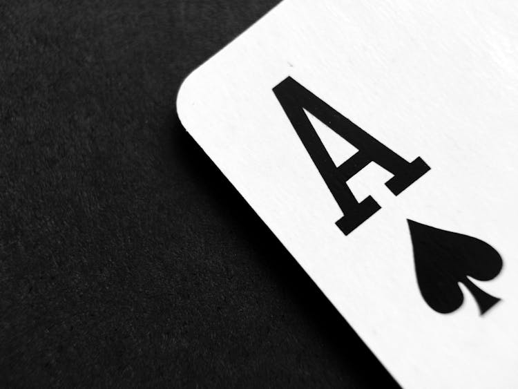 Ace Of Spade Playing Card On Grey Surface