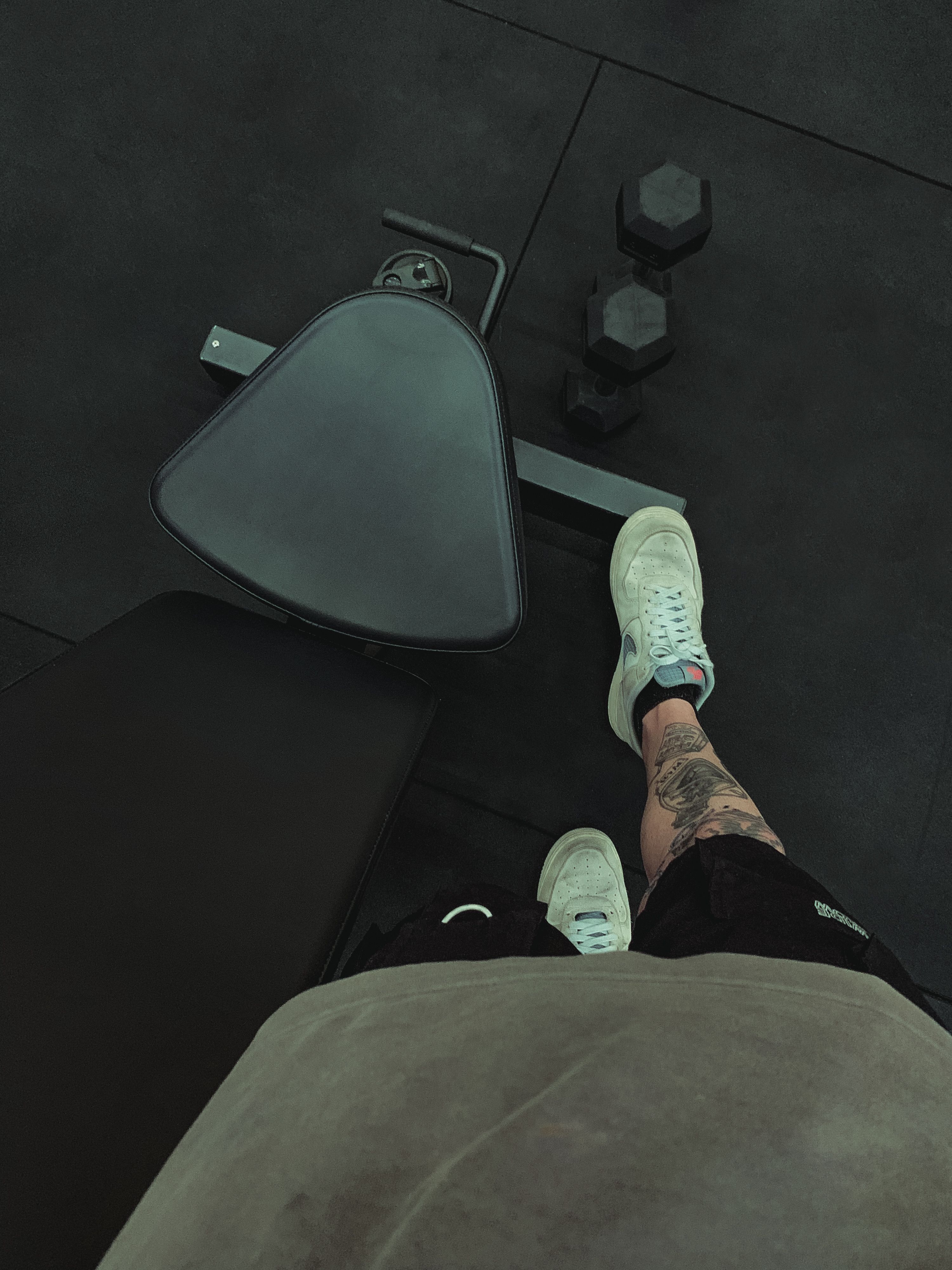 Legs of Man Standing over Bench at Gym · Free Stock Photo