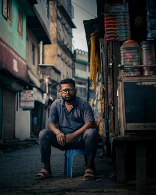 Free Market Maven: The Shopkeeper's Solitude Stock Photo