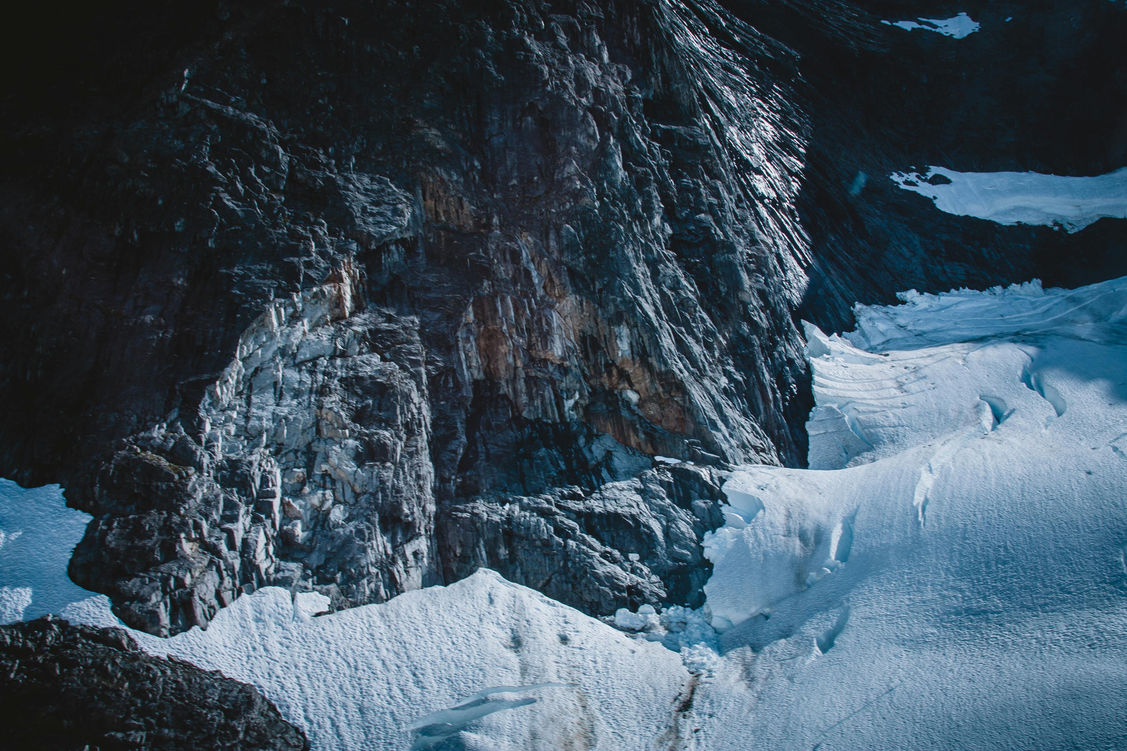 helicopter view of alaskan glacial cliff