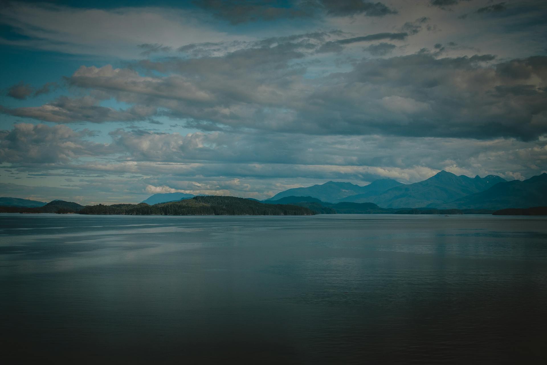 Tranquil Alaskan Waters Under Moody Skies