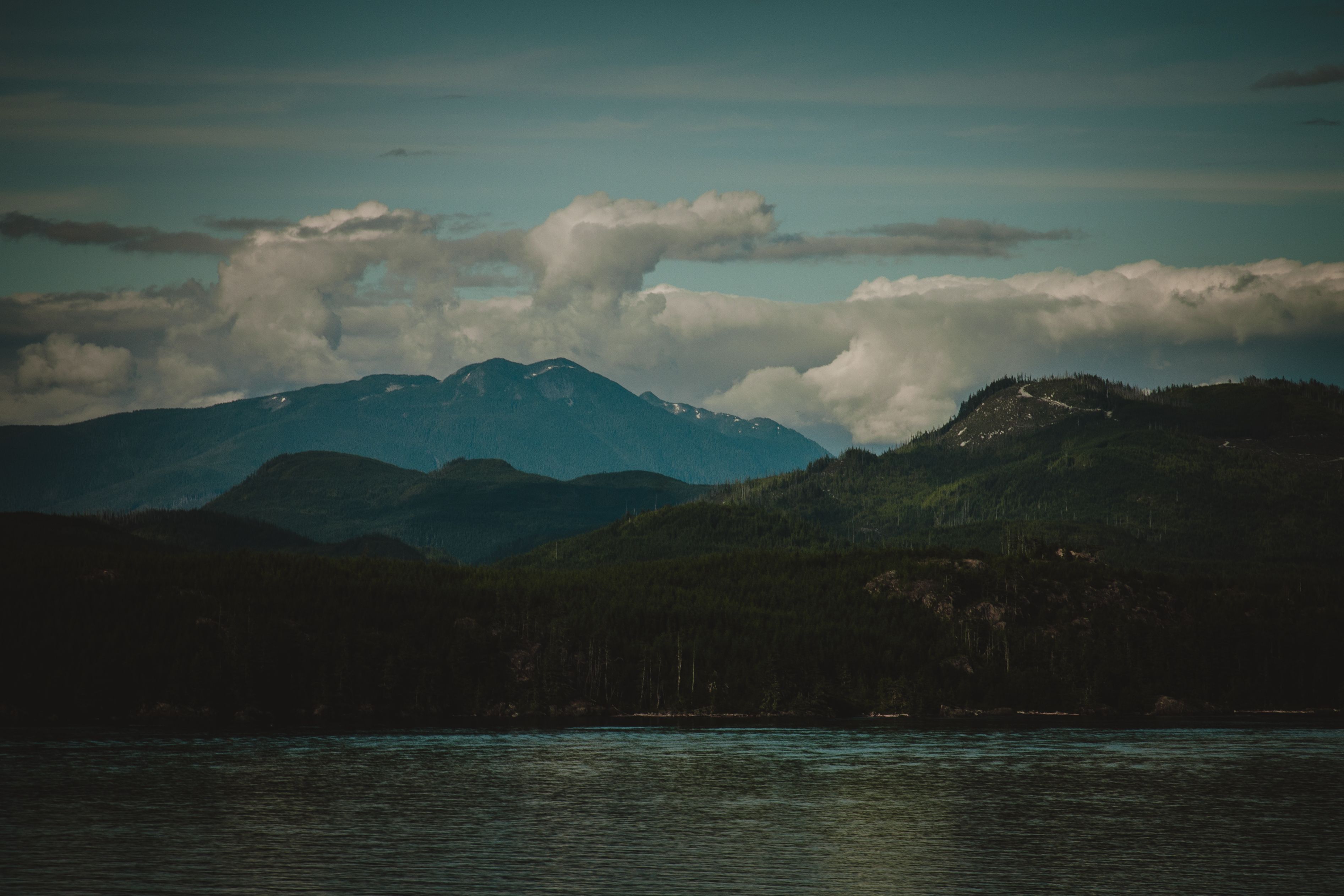Best Adventure Kart Expedition- Ketchikan, AK Review: The Ultimate Off-Road Rainforest Adventure Review 2026 - Breathtaking view of mountains under a cloudy sky, reflecting in serene water.
