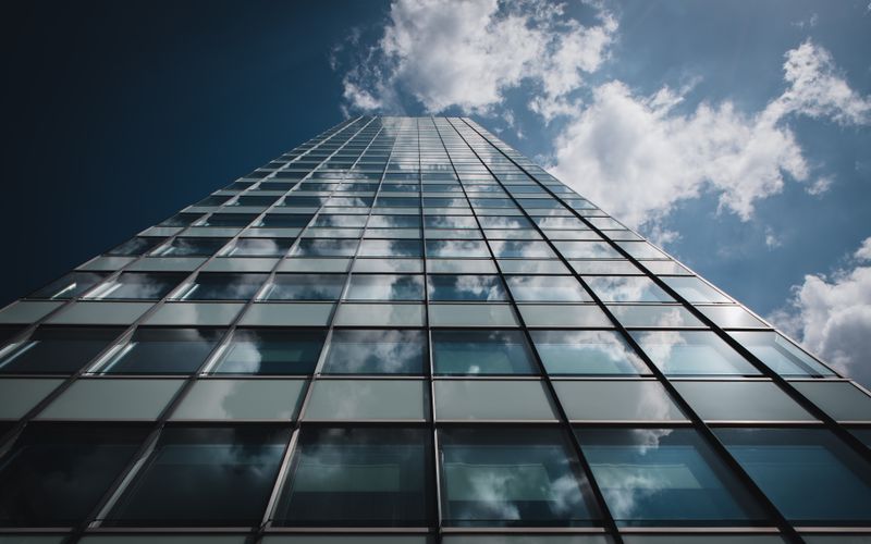 Glass tower seen from street level — photo by Wolfgang Weiser on Pexels