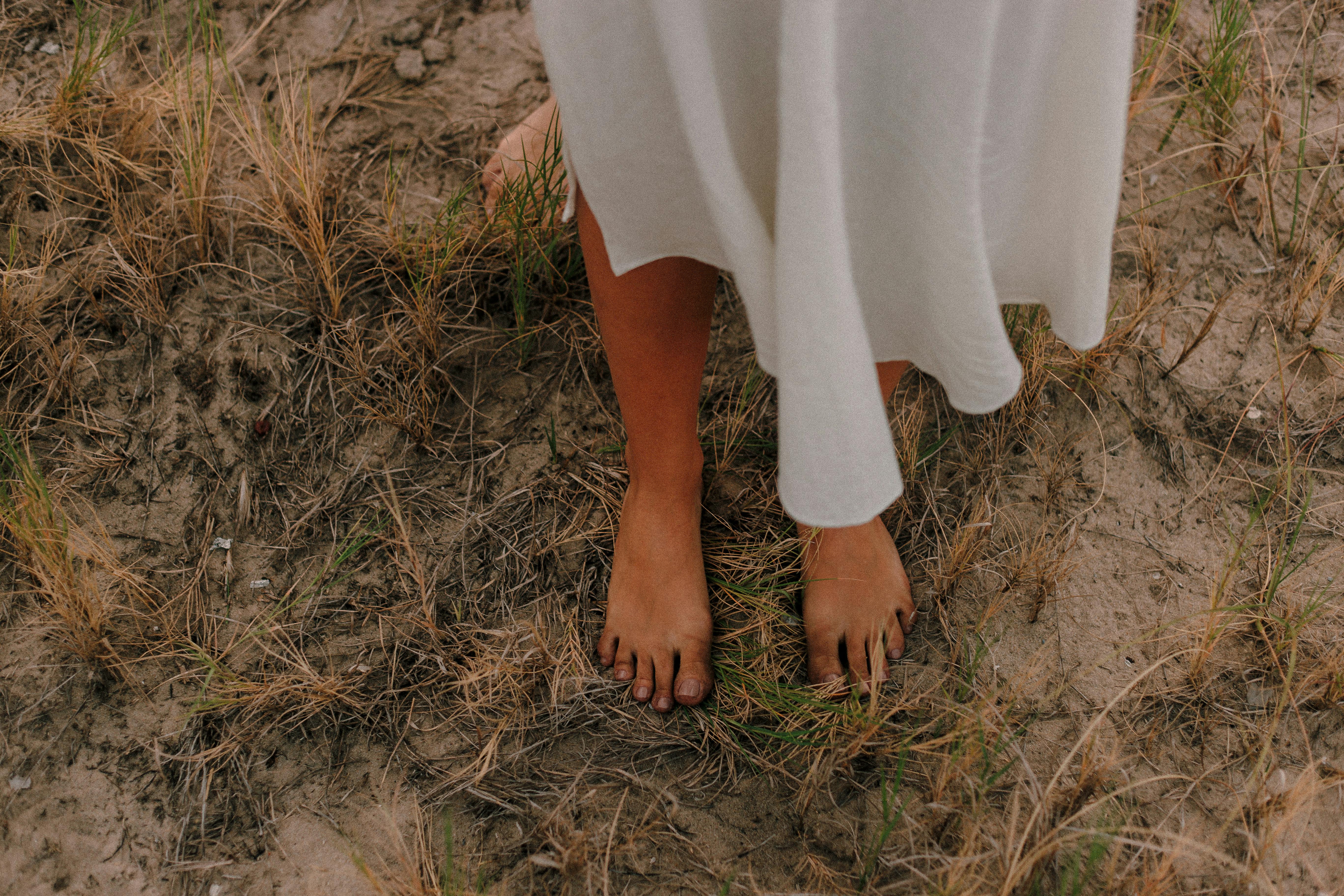 photo of person standing on grass