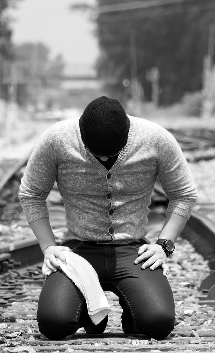 Man Kneeling On Floor