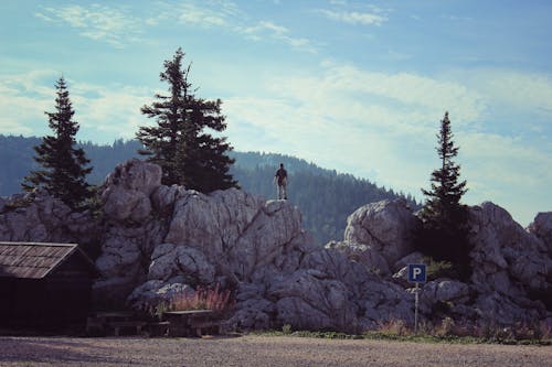 Free Man Standing on Cliff Stock Photo