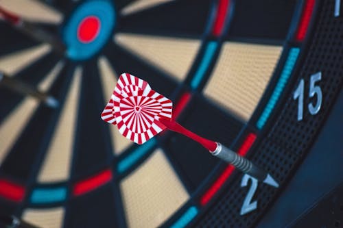 Red and White Dart on Darts Board