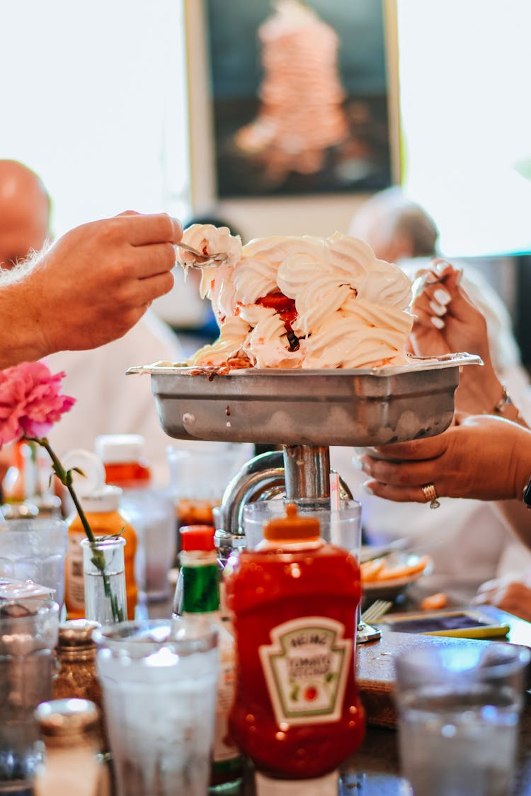 Person Holding Spoon With Ice Cream