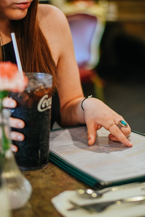 Woman Reading a Menu