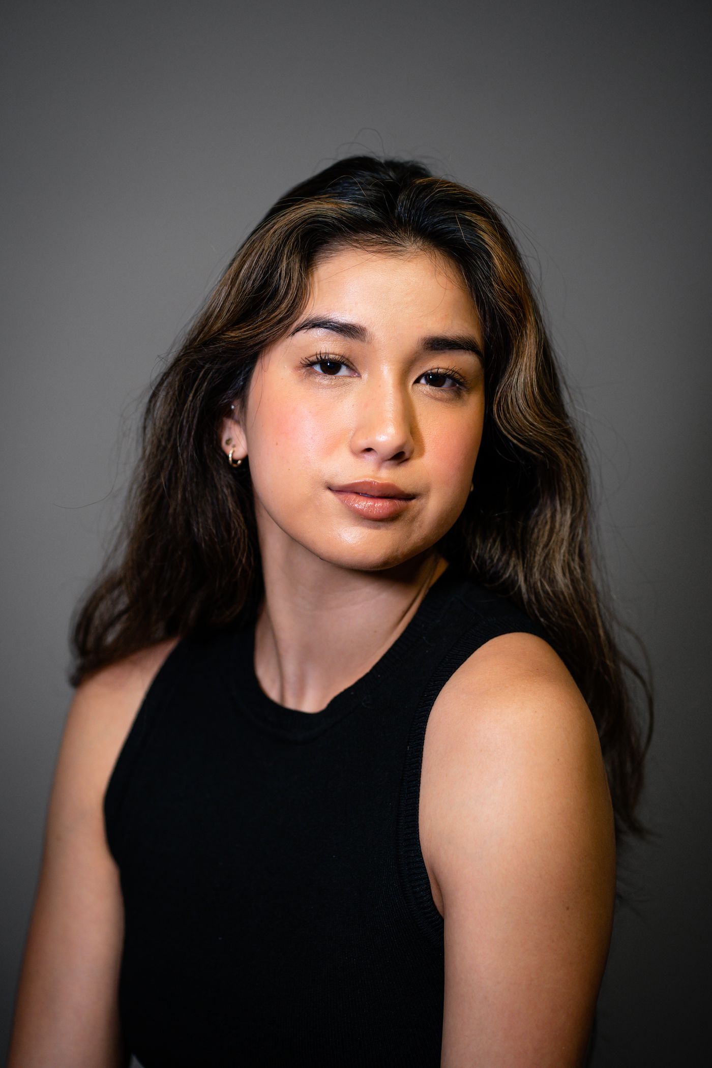 Studio portrait of a performer against a plain backdrop