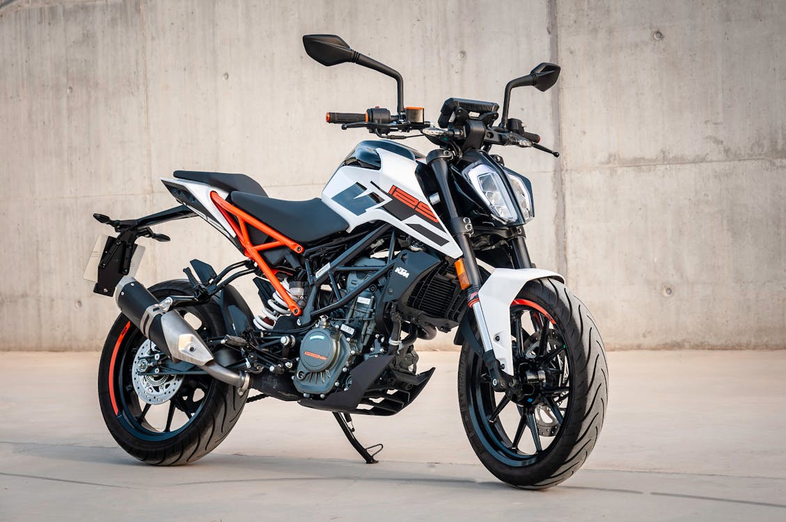 Photo of a black, white and orange motorcycle