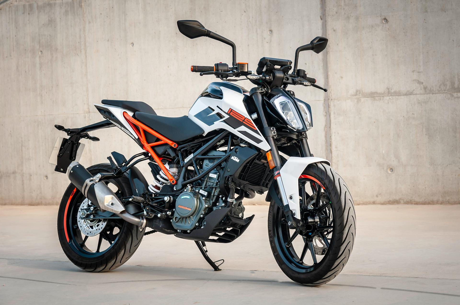 Photo of a black, white and orange motorcycle