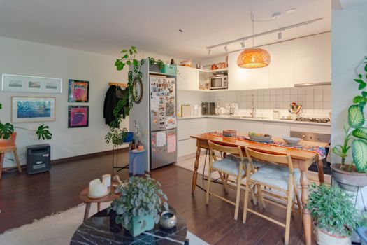 A stylish kitchen and dining area with contemporary design and abundant natural light.