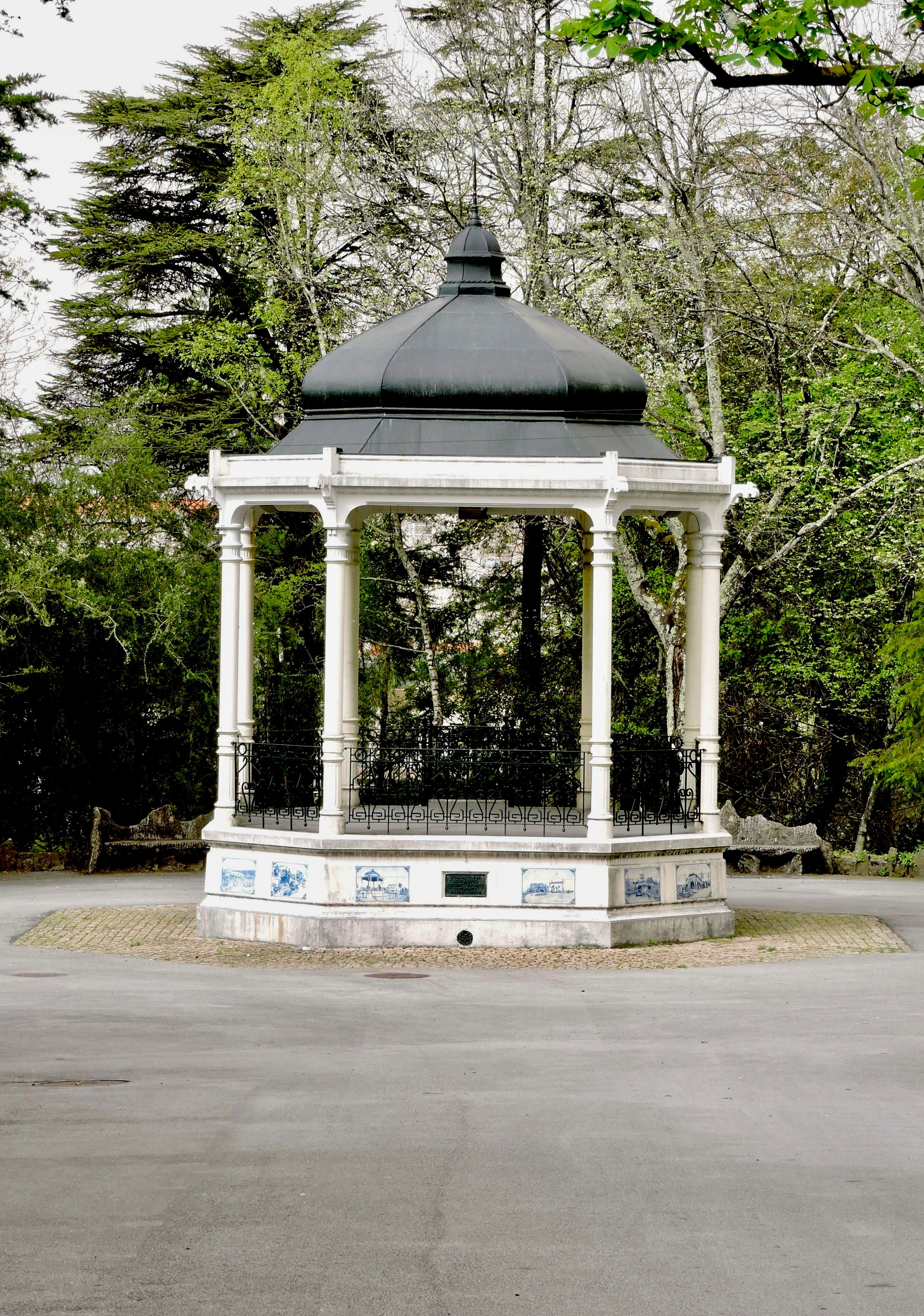 Elegant black-roofed gazebo, set in lush greenery of Parque de La Salette, Oliveira de Azemeis.