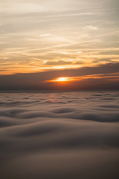Free Безкоштовне стокове фото на тему «Захід сонця, море хмар, небо» Stock Photo