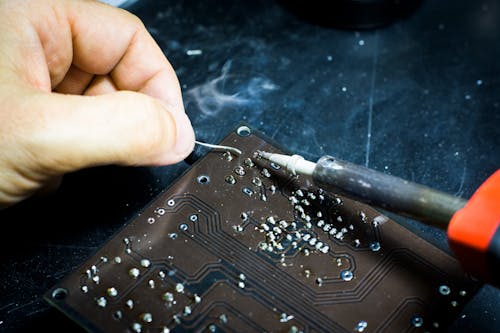 Free Person Soldering Chip Stock Photo