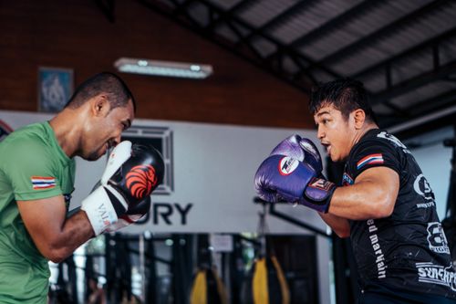 Free Two men train in a lively boxing session, showcasing skill and intensity indoors. Stock Photo
