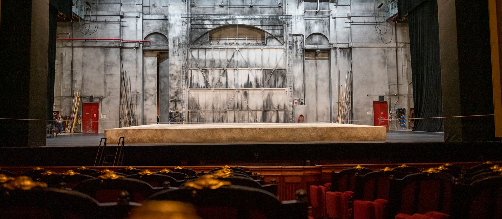 Empty theater stage with backdrop and seating in Paris, France.