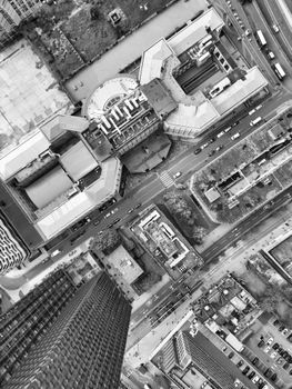 Black and white aerial view of London cityscape showcasing urban architecture and streets.