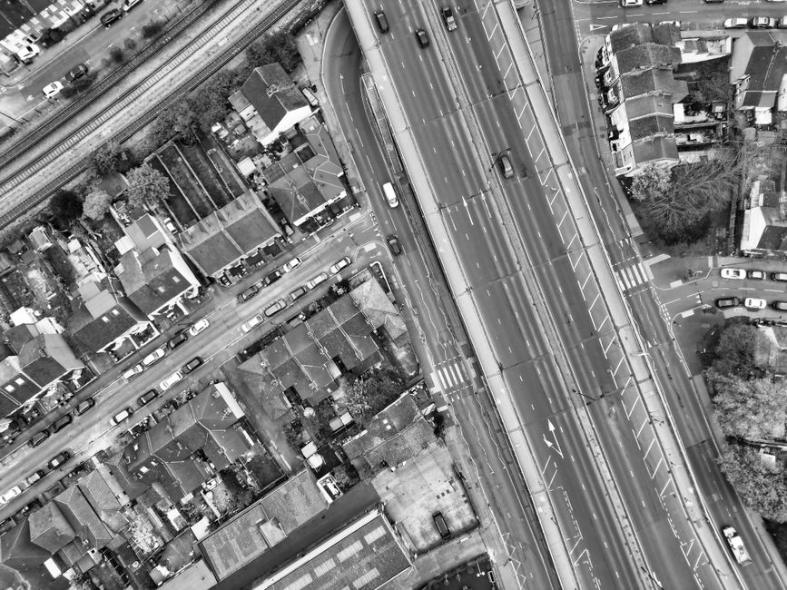 Black and white aerial photo capturing the urban layout and roads in Greater London, England.