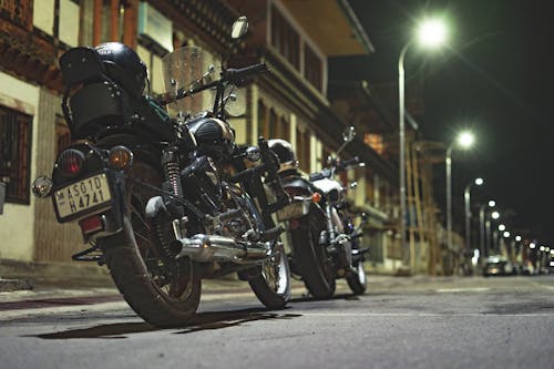 Two Motorcycles Parked on a Street