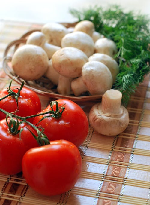 Free Four Red Tomatoes and Mushroooms Stock Photo