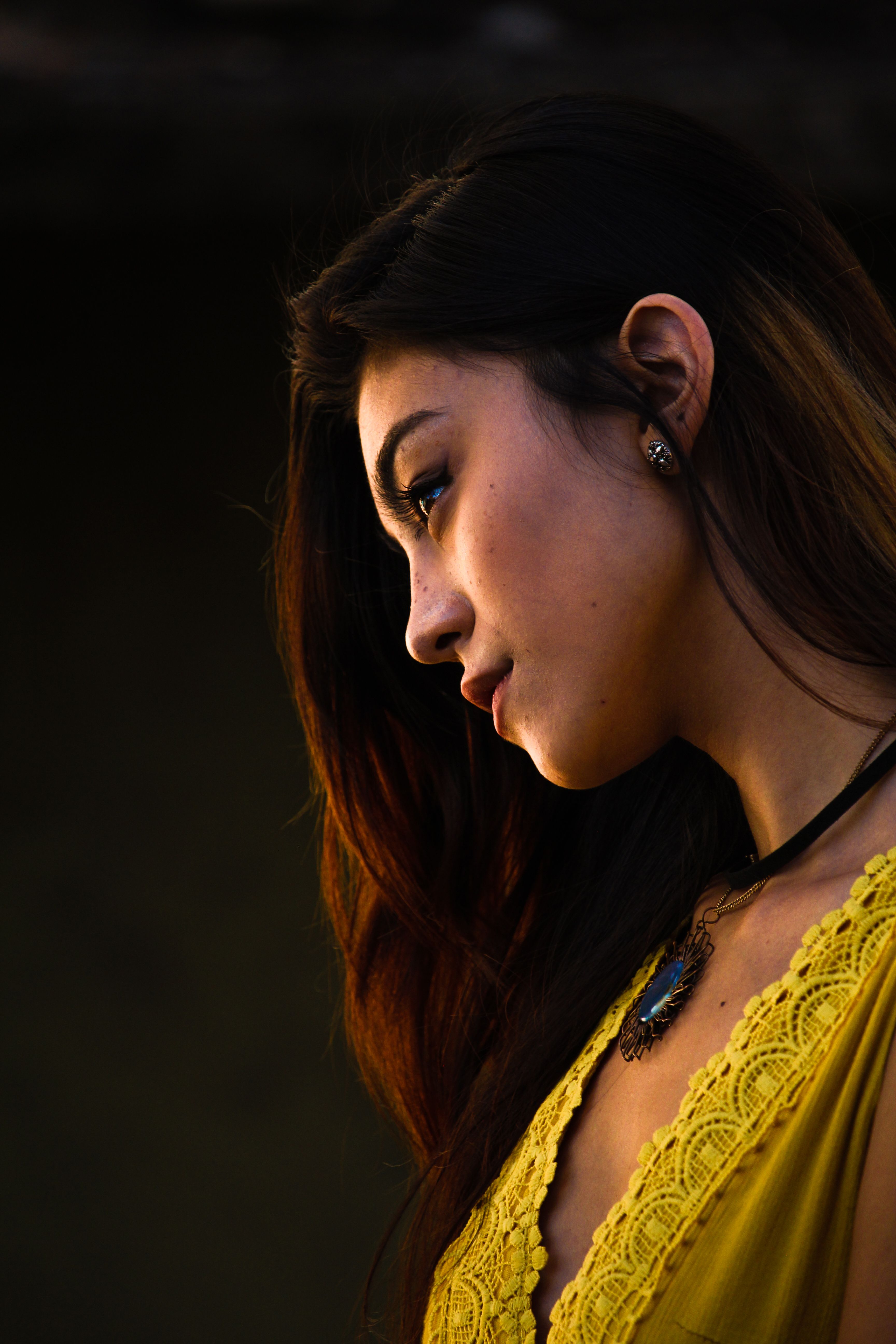 Side View Portrait Photo Of A Woman Wearing Yellow Top Free