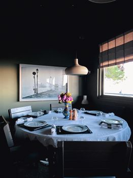Cozy dining room with elegant table setting, perfect for intimate gatherings.