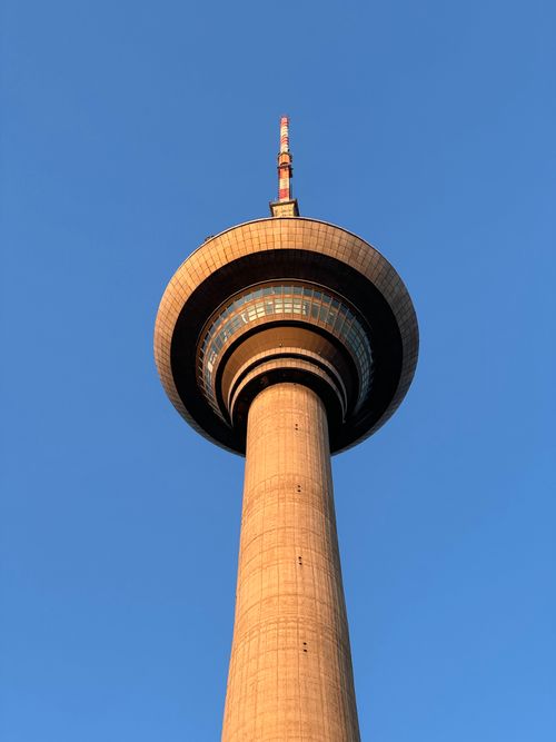 Free The iconic Tianjin TV Tower captured from a low angle against a clear blue sky. Stock Photo
