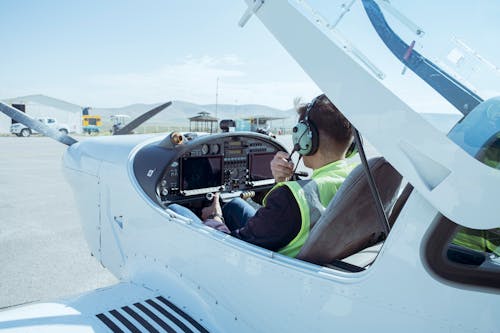 Pilot Sitting in Airplane Cockpit