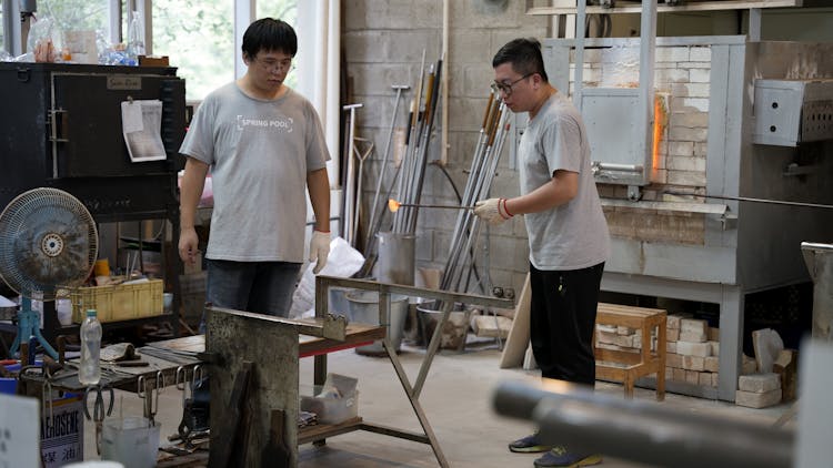 Men Working In Workshop 