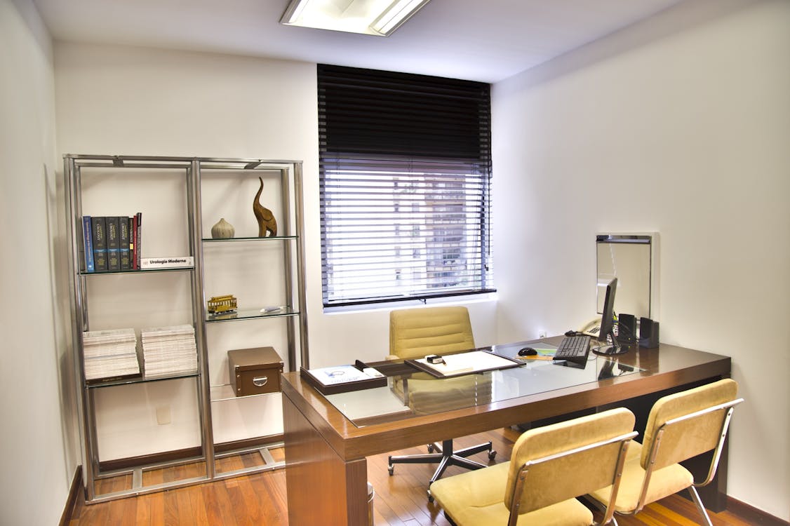 minimalist office with desk, chairs and shelf
