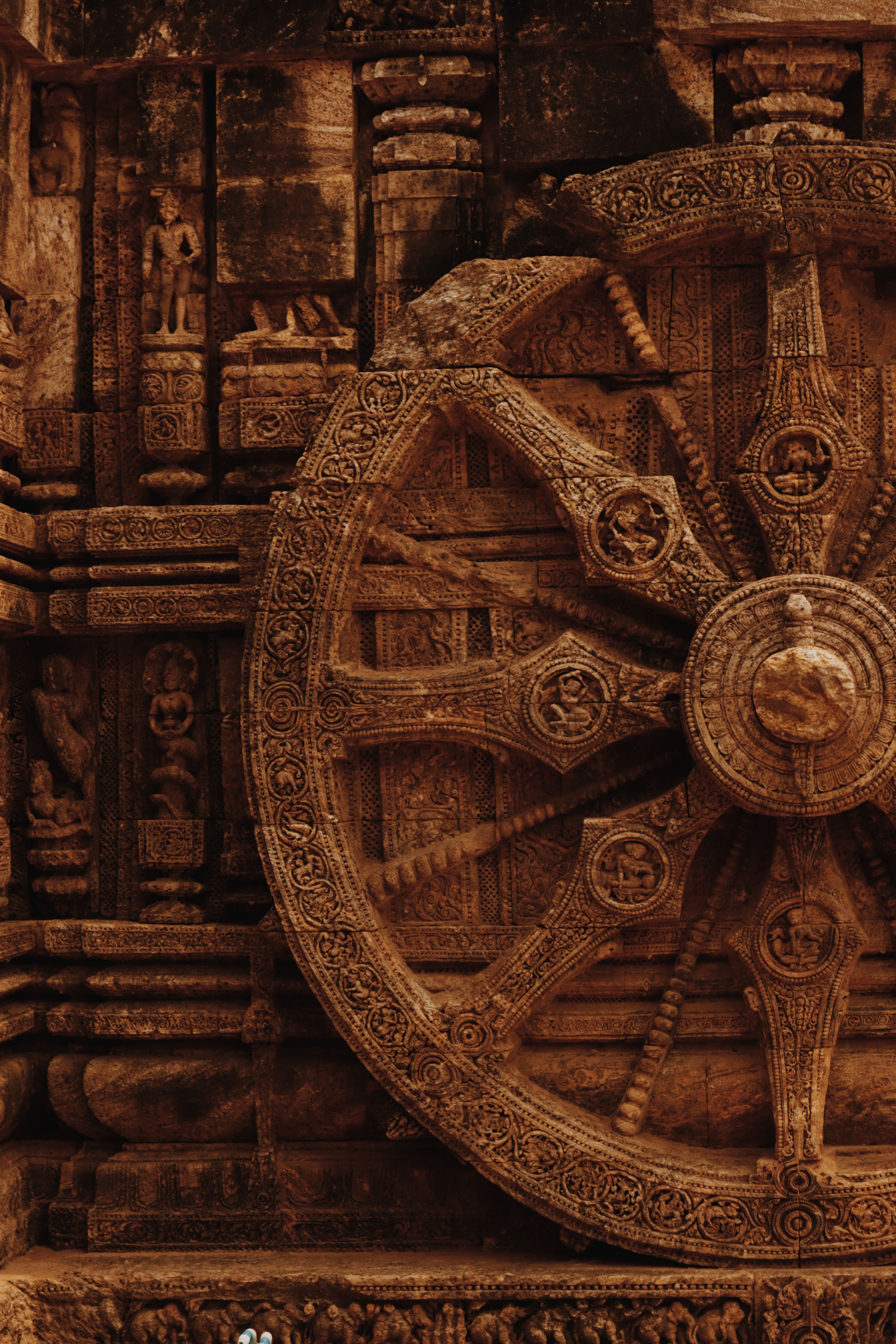 Close-up of the intricately carved stone wheel at Konark Sun Temple, showcasing ancient craftsmanship.