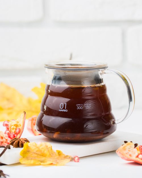 Free Warm autumn coffee in glass pot surrounded by colorful leaves. Stock Photo