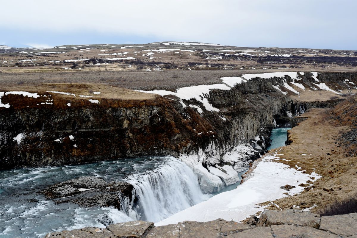 Gullfoss waterfall dropping into its canyon in winter