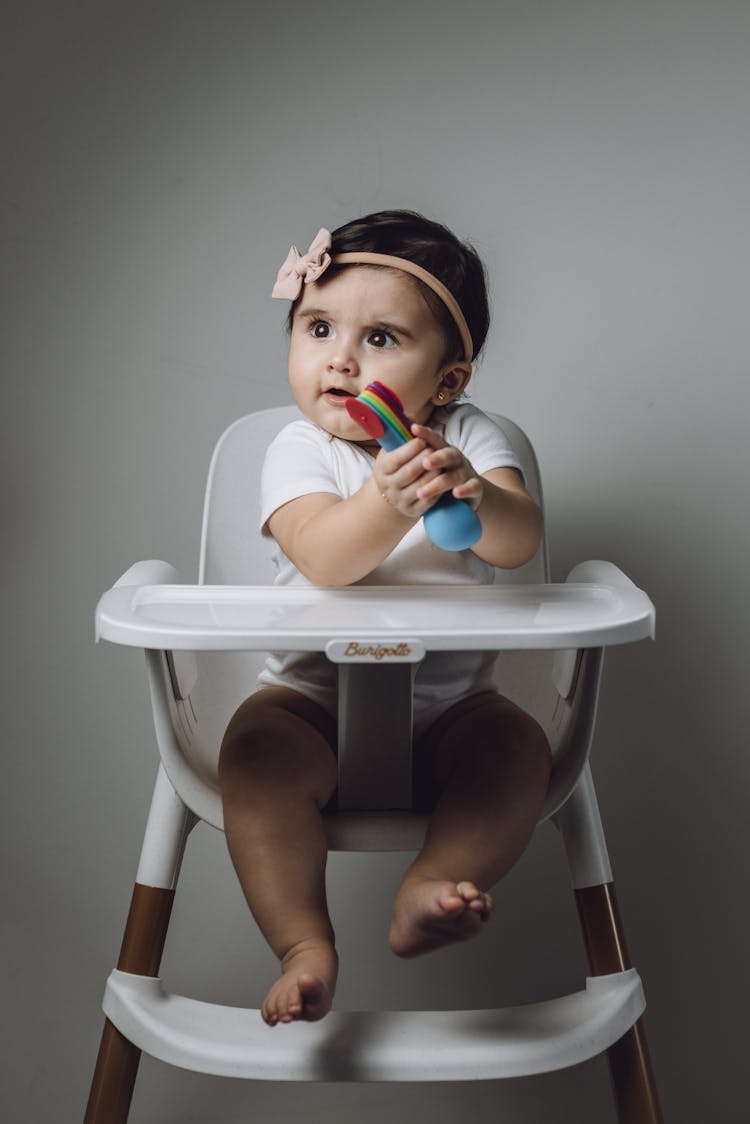 A Child In A High Chair