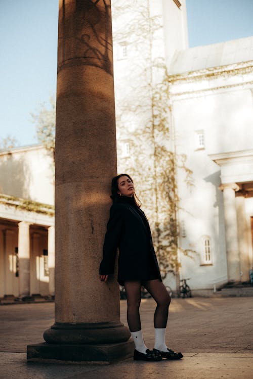 Portrait of lady in classic outfit around Church