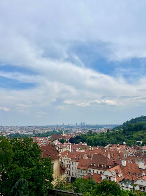 Free Scenic aerial view of Prague's historic rooftops and skyline on a clear day. Stock Photo