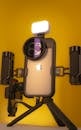 iPhone with some filming accessories.