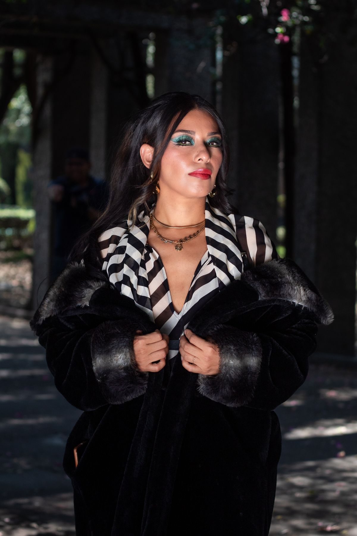 Latina woman wearing a ruffled flamenco-inspired dress with movement
