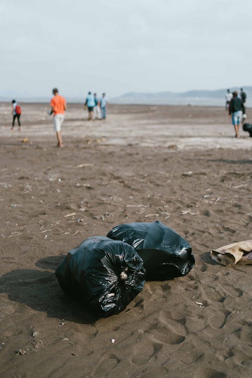 Photo Of Trash Bag On Sand