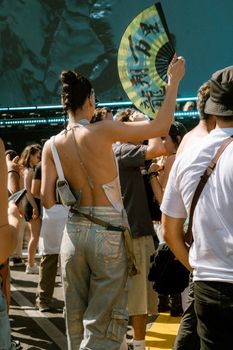 Crowd enjoying a vibrant summer festival, with a focus on fun and entertainment.